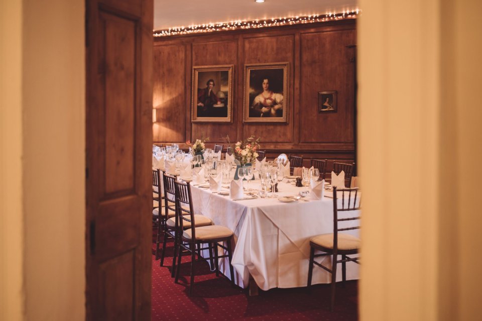 A dining room at Hintlesham Hall set out for a Suffolk wedding