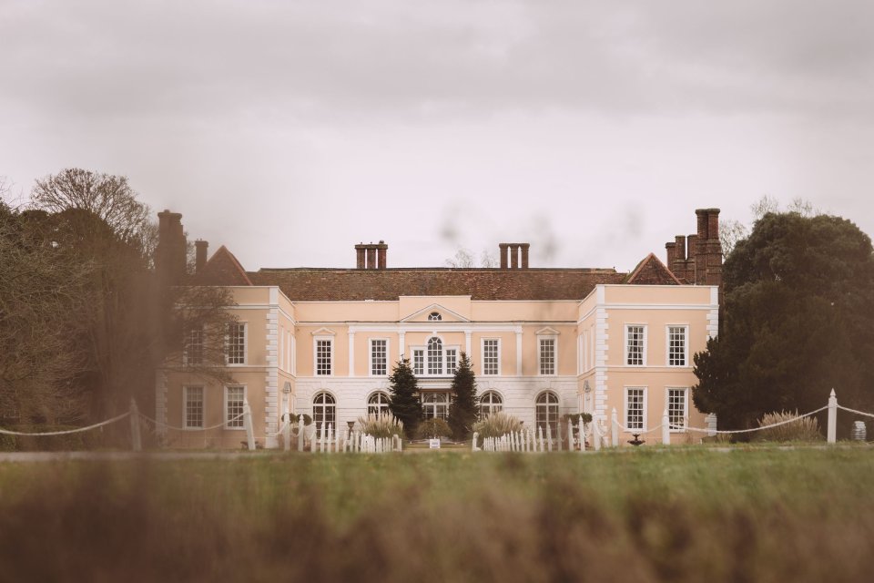 Exterior wide frontal photograph of premier Suffolk Wedding venue Hintlesham Hall