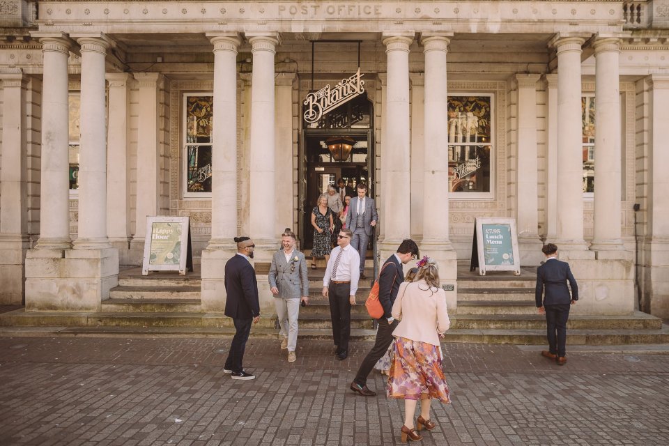Guests gather outside The Botanist and head towards Ipswich Town Hall