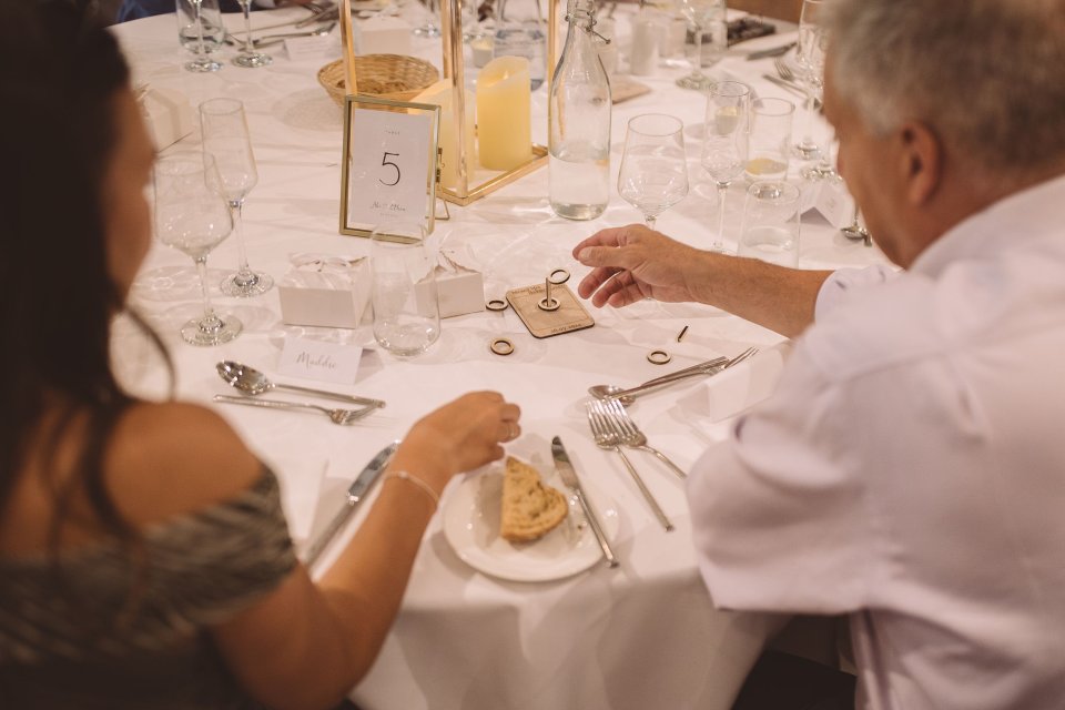 Wedding guests playing small wooden games at a table